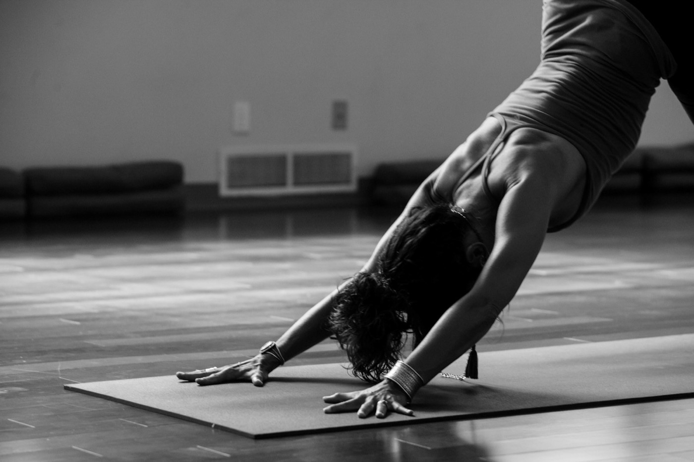 Students holding a restful hatha yoga pose in the Hertford Yoga studio